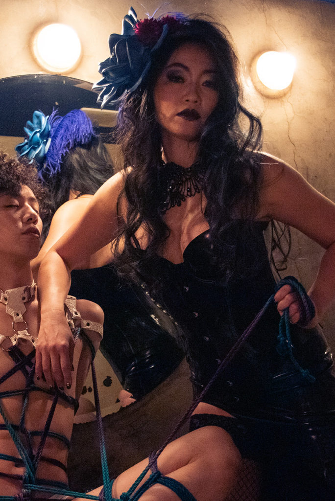 mistress amrita glamourous japanese fetish model wearing black latex dress doing rope bondage on japanese slave photo by shintaro japanese photographer